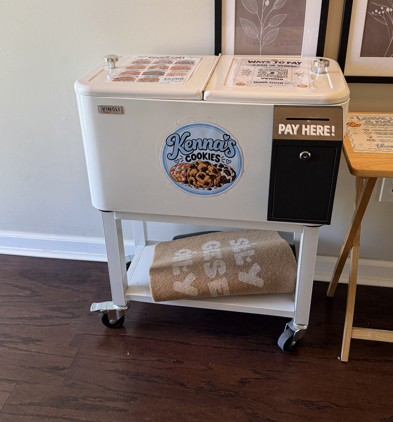The Kenna's Cookies cart: a white cooler cart with the logo and a PAY HERE box